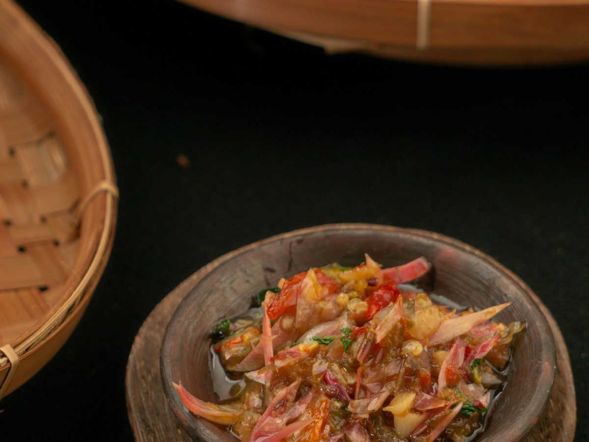 Wet palapa cooked in coconut milk, a rich orange chilli and ginger relish in a bowl